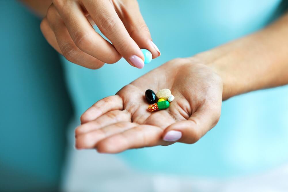 A person holding supplements