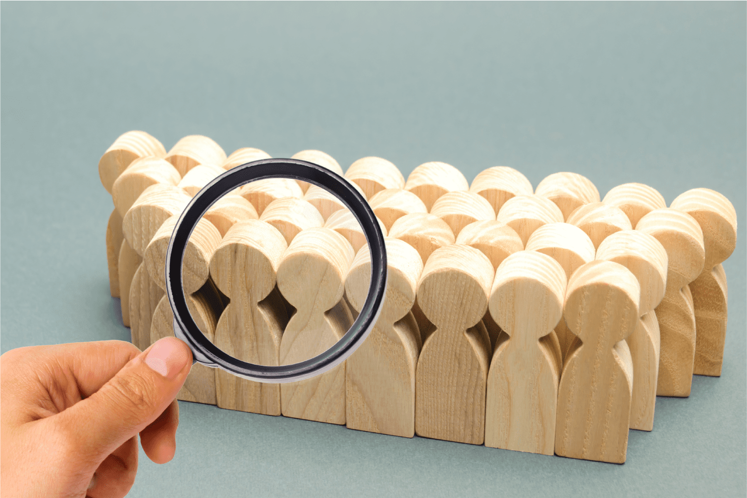 using magnifying glass on wooden stand